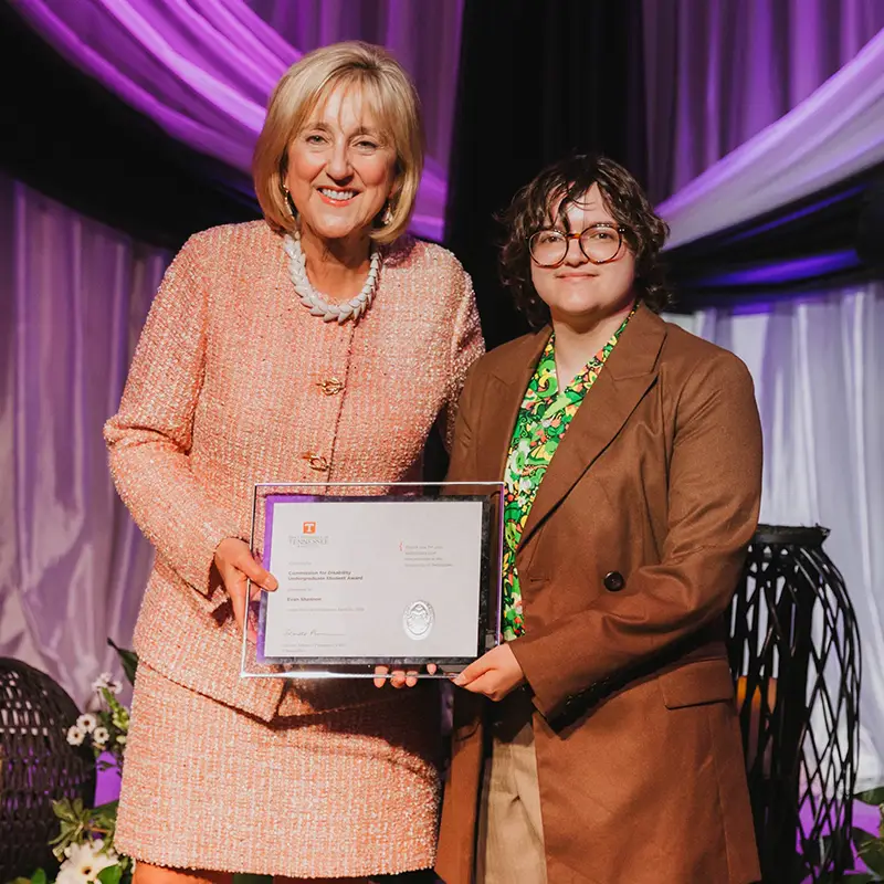 University of Tennessee Chancellor Donde Plowman presents the Commission for Disability Undergraduate Student Award to Evan Shannon for furthering recognition of and support for disabled people at UT.