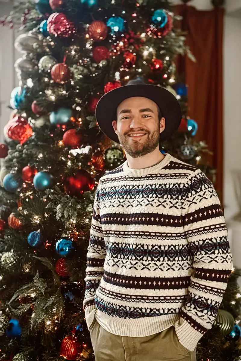 Brant Entrekin pictured in front of a Christmas tree.